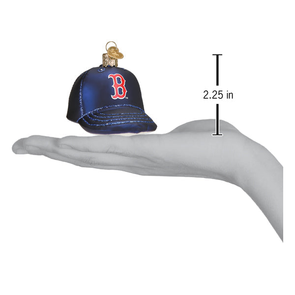 Miniature baseball cap ornament shaped like a Red Sox navy cap with red "B" logo, shown at 2.25 inches tall in palm of hand for scale