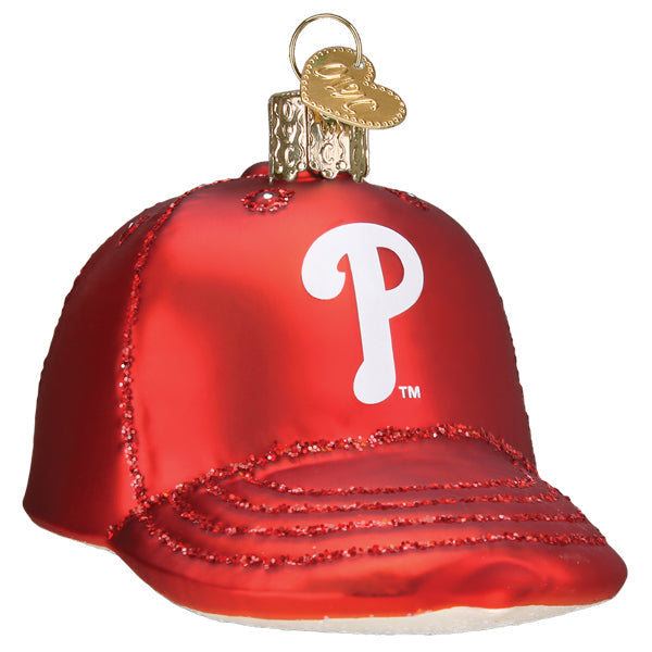 Red glass baseball cap ornament with white P logo and beaded trim detail, gold metal cap and loop hanger