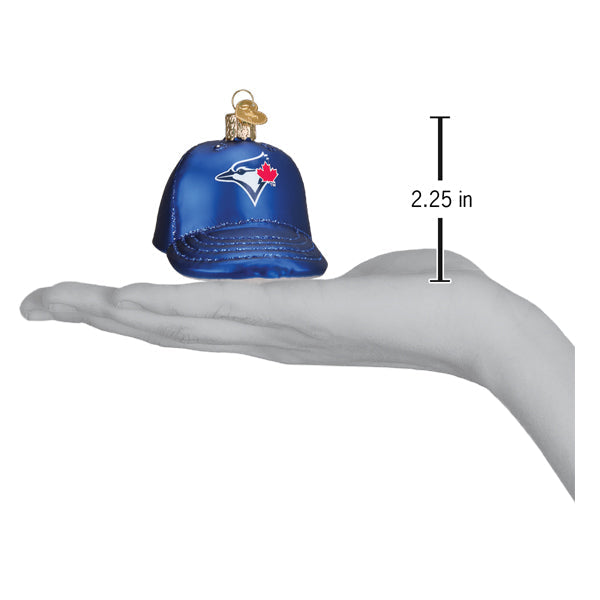 Blue baseball cap ornament featuring Toronto Blue Jays logo held in open palm, showing 2.25 inch height measurement