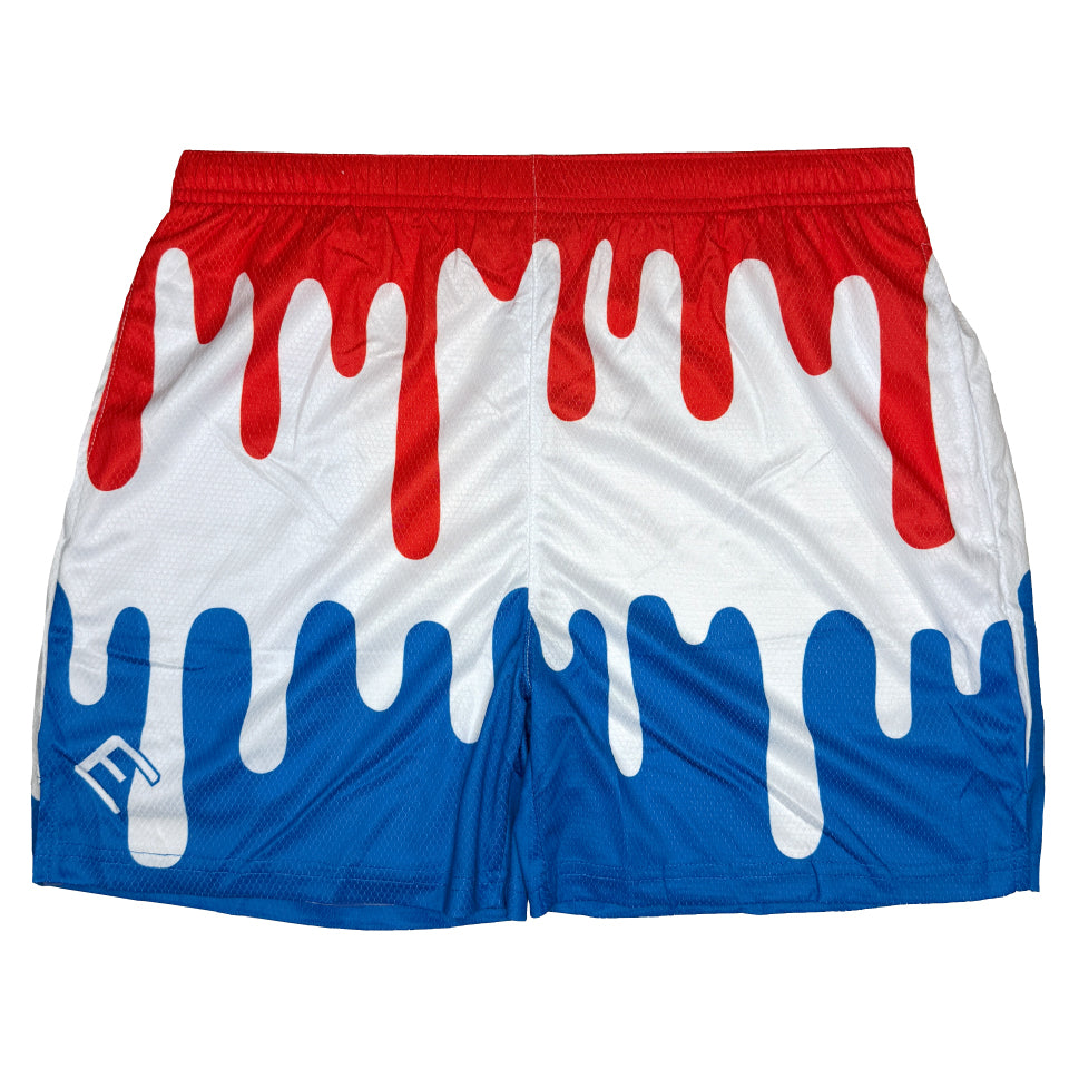 Red, white, and blue drip-pattern athletic shorts with white melting effect overlays, elastic waistband, and side seams visible on flat lay display