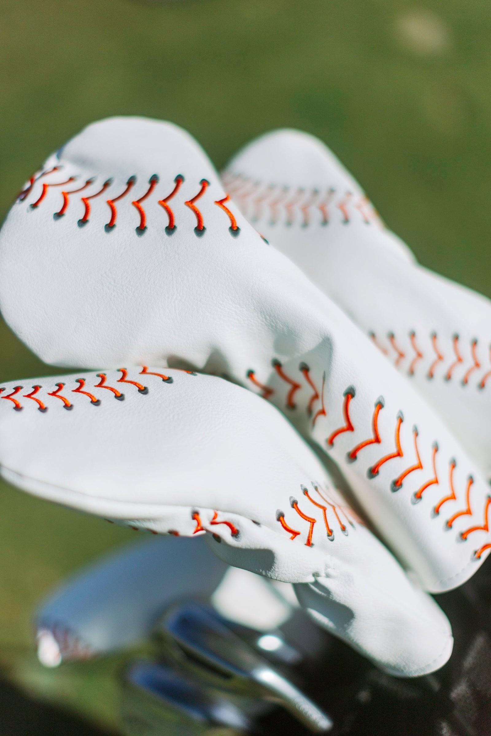 Baseball seam golf headcover with red stitching, PU leather, for driver, wood, or fairway clubs.