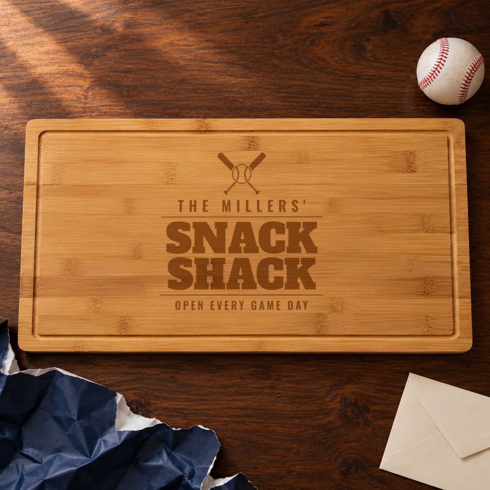 Personalized baseball mom cutting board engraved THE MILLERS' SNACK SHACK OPEN EVERY GAME DAY, just unwrapped as a gift from a friend