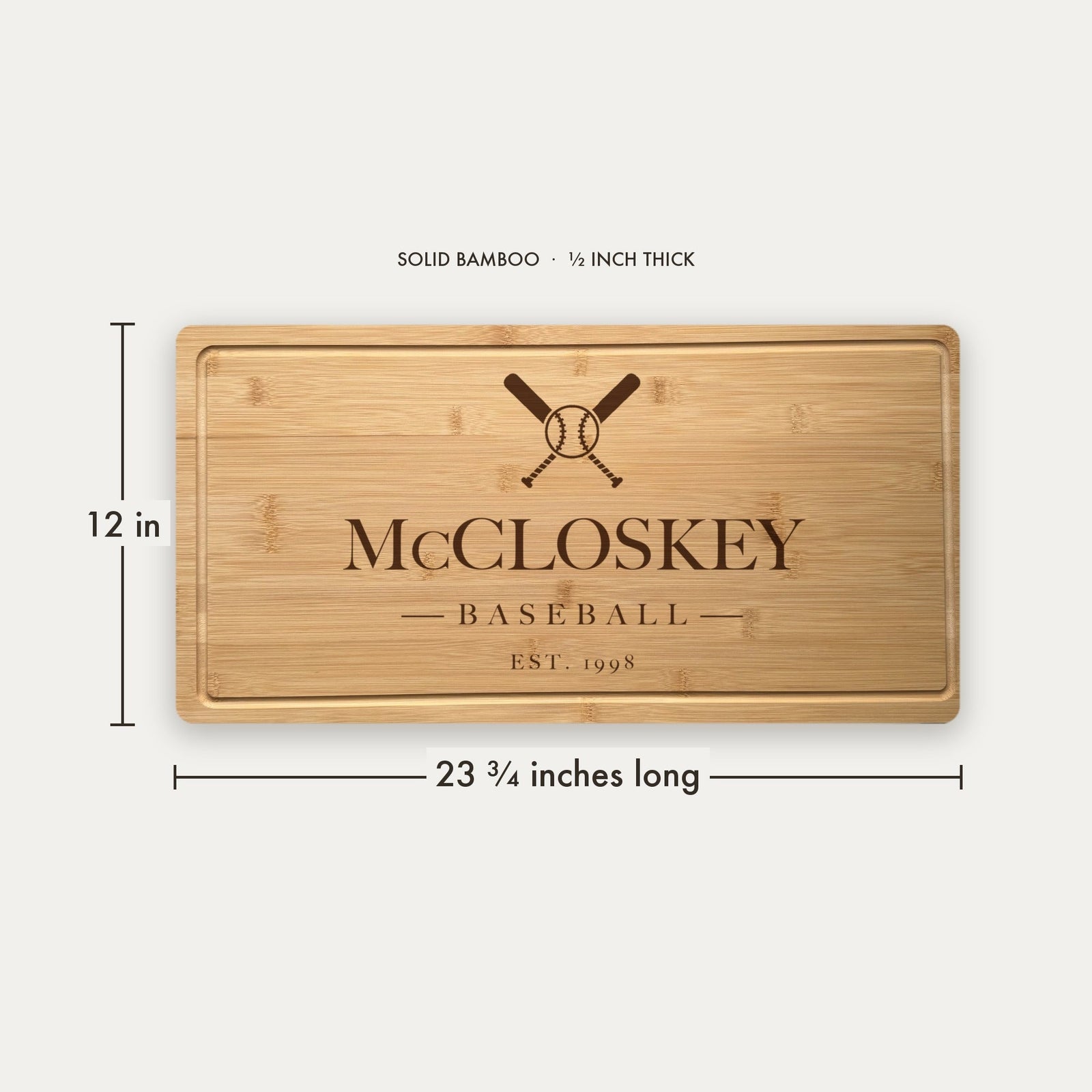 Size guide for the personalized baseball cutting board, 23 and three quarter inches long by 12 inches wide in half inch thick solid bamboo.