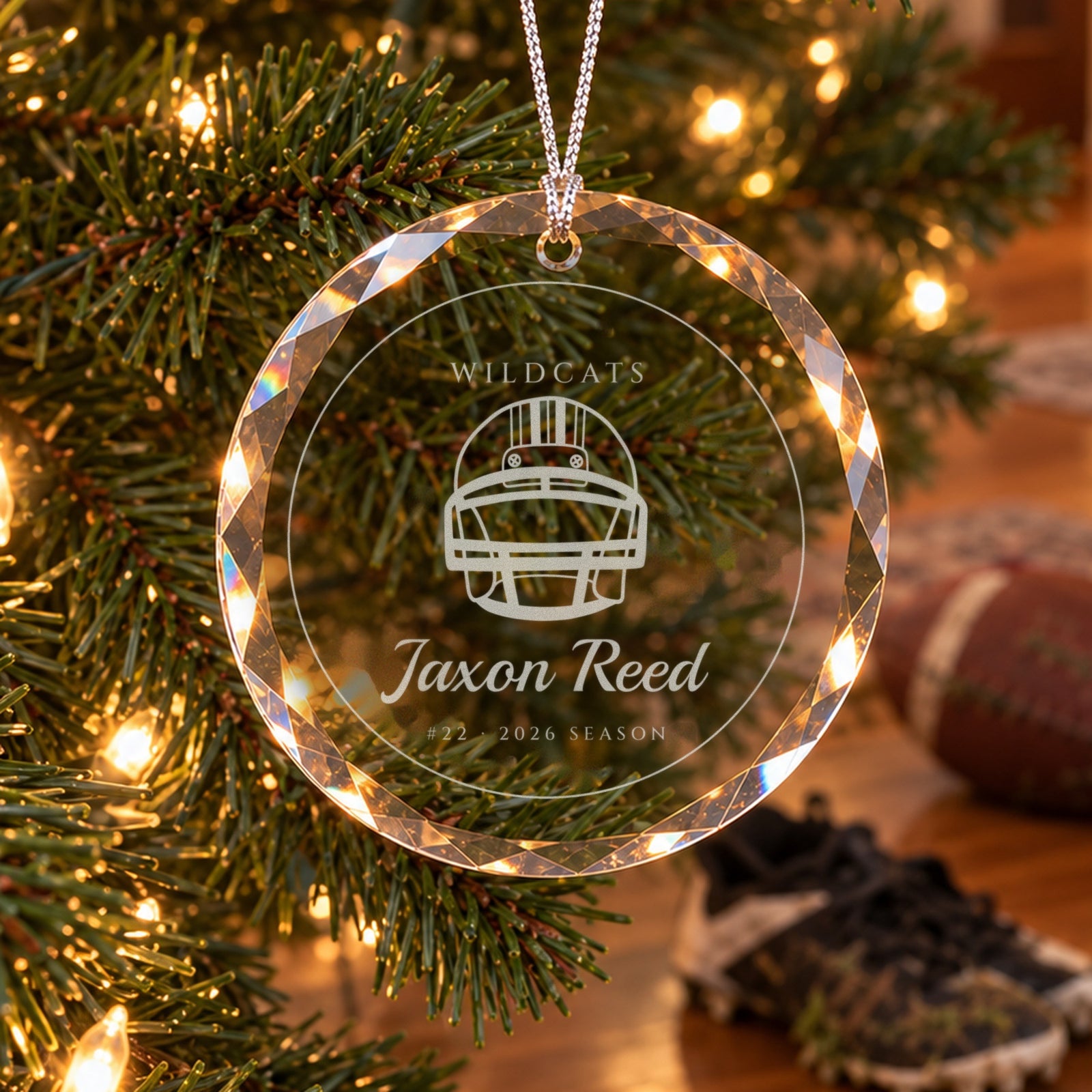 Personalized football ornament in faceted glass on a Christmas tree, engraved with a football helmet, WILDCATS, Jaxon Reed, #22 · 2026 SEASON