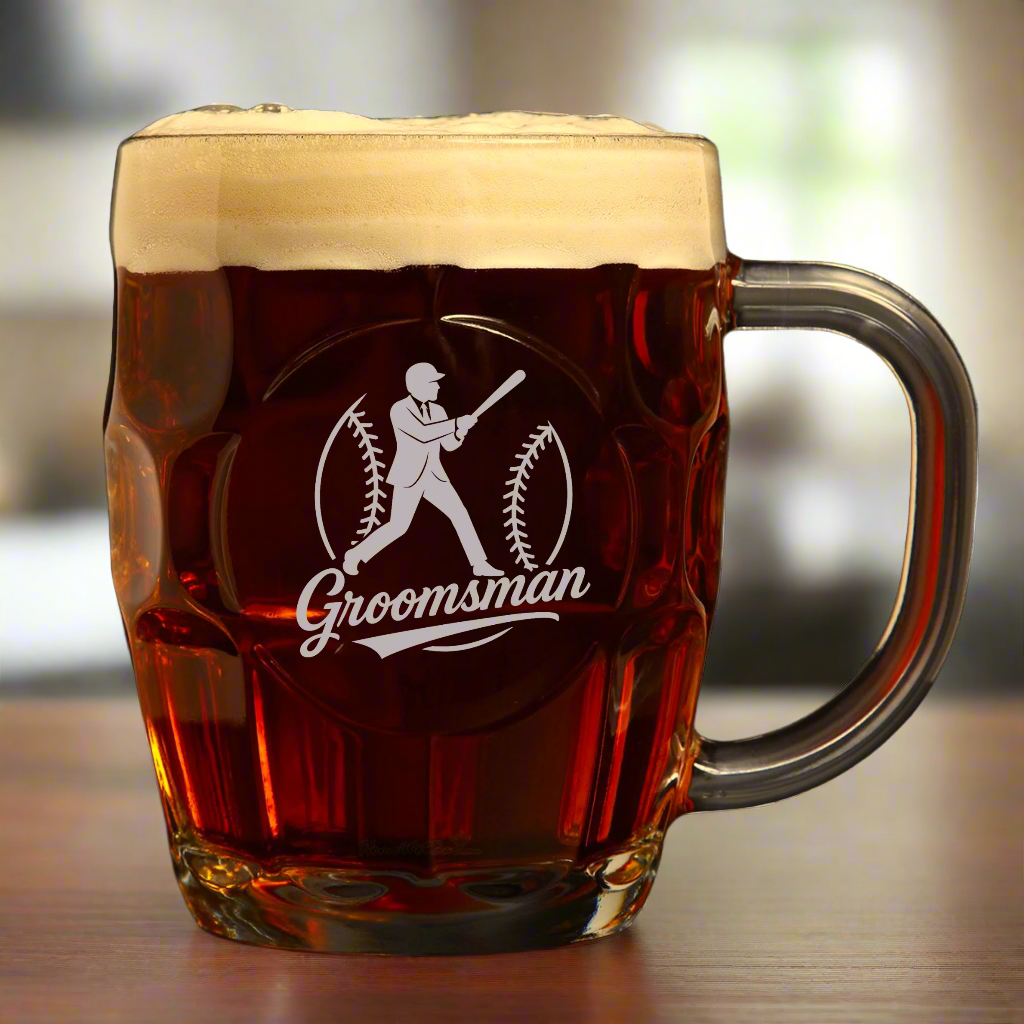 Glass mug with 'Groomsman' engraving filled with beer on a white background
