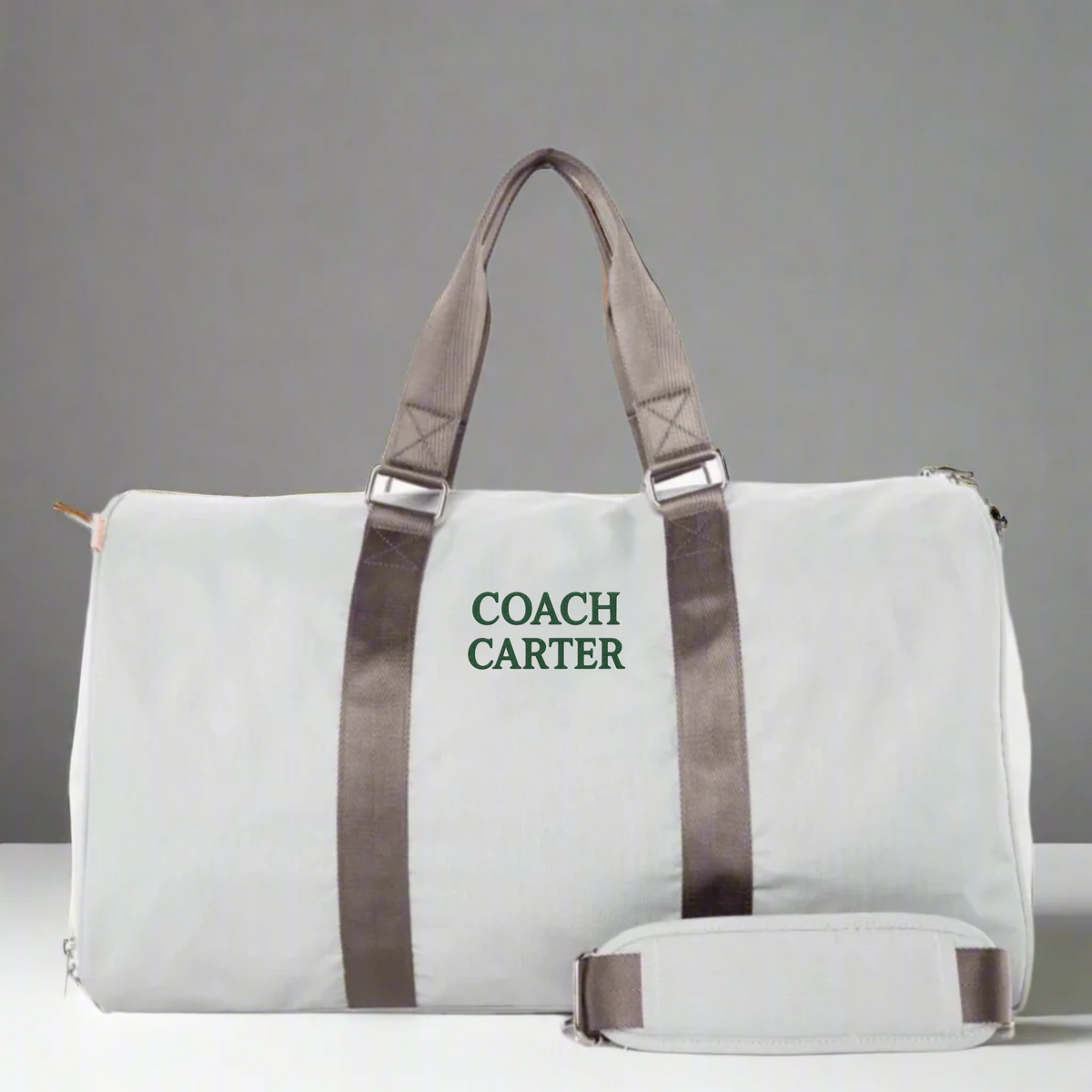 Personalized soccer coach travel bag in durable polyester with a dedicated shoe compartment and detachable shoulder strap, embroidered with custom initials