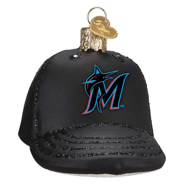 Black baseball cap ornament with blue and red Marlins logo and metallic beaded trim detail, topped with gold metal cap charm