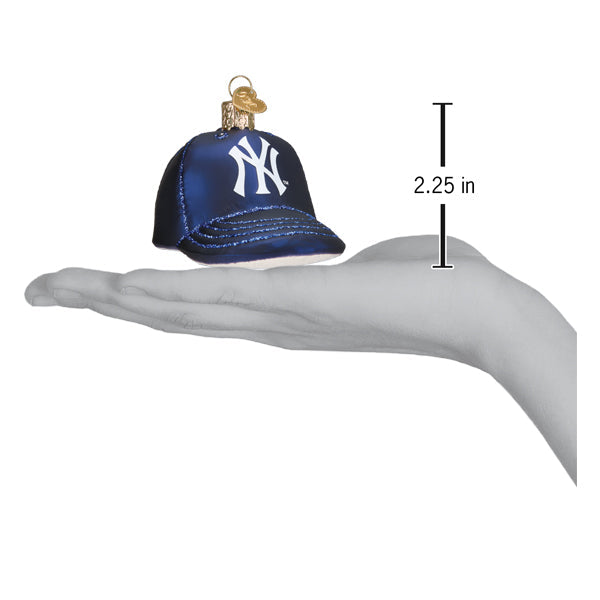 Navy blue baseball cap ornament with white NY logo displayed on a hand showing 2.25 inch height measurement