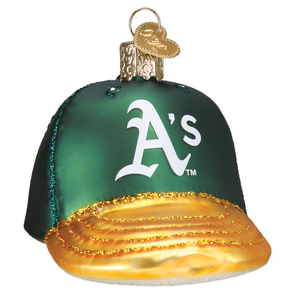 Close-up of the green Athletics cap glass ornament showing the white 'A's' logo and the gold glittered brim detail