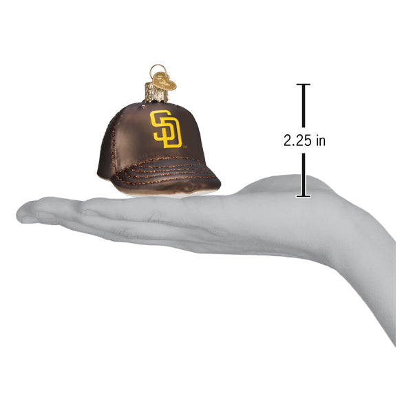 Brown and gold baseball cap ornament with SD logo shown at 2.25 inches tall in palm of hand for size reference