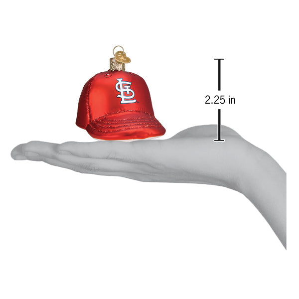 Red Cardinals baseball cap ornament held in a palm, measuring 2.25 inches in height, with white team logo visible on the front and gold hanging loop