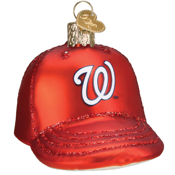 Red glass baseball cap ornament with white "W" logo and glitter-trimmed brim detail, featuring brass cap topper and loop hanger