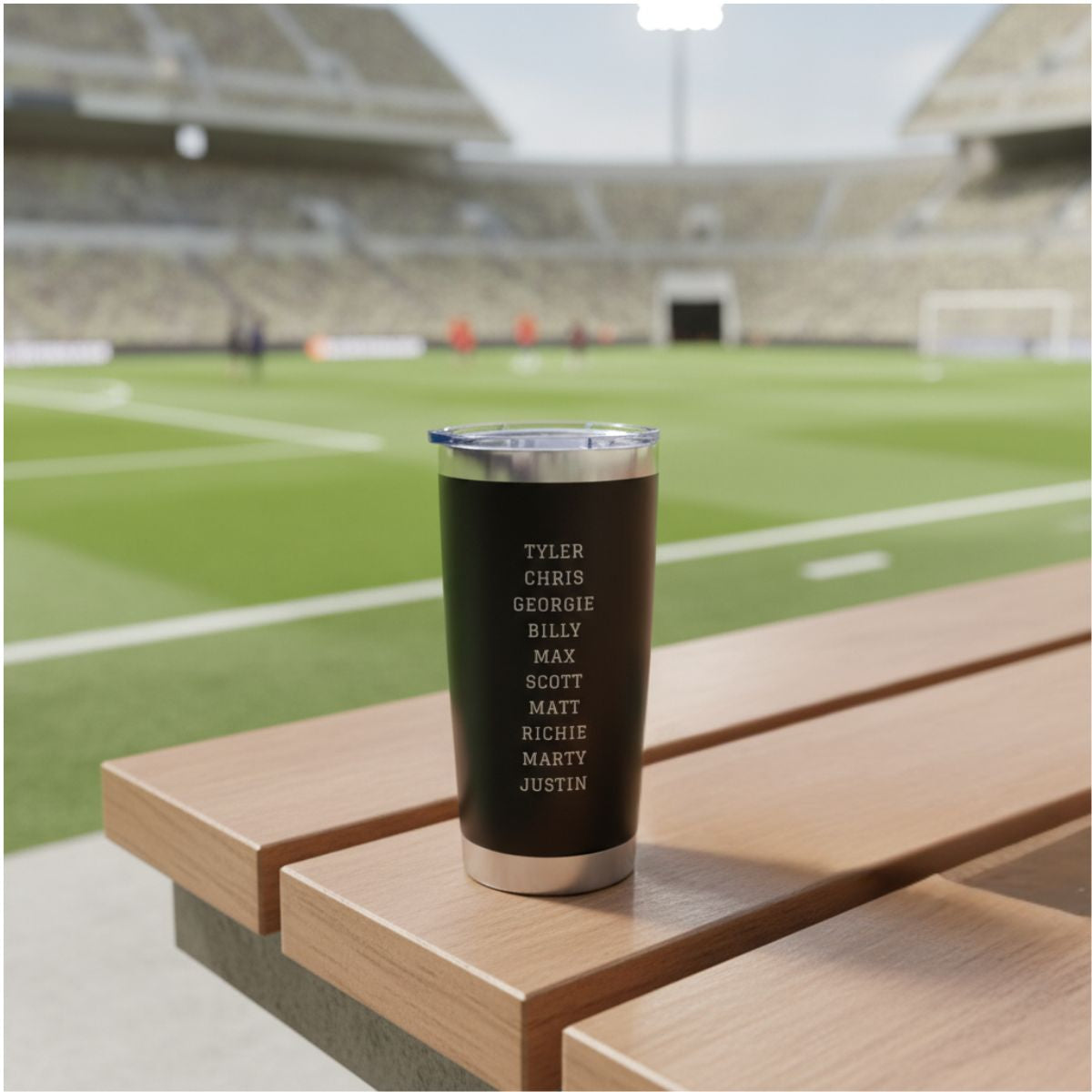 Personalized soccer coach tumbler with the coach's name and a soccer design engraved on the front and the full team roster engraved on the back