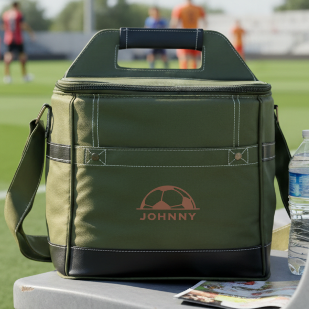 Personalized Pitch Day soccer cooler, a soft canvas insulated bag with faux leather trim embroidered with a name, holding up to 12 cans with a built-in bottle opener