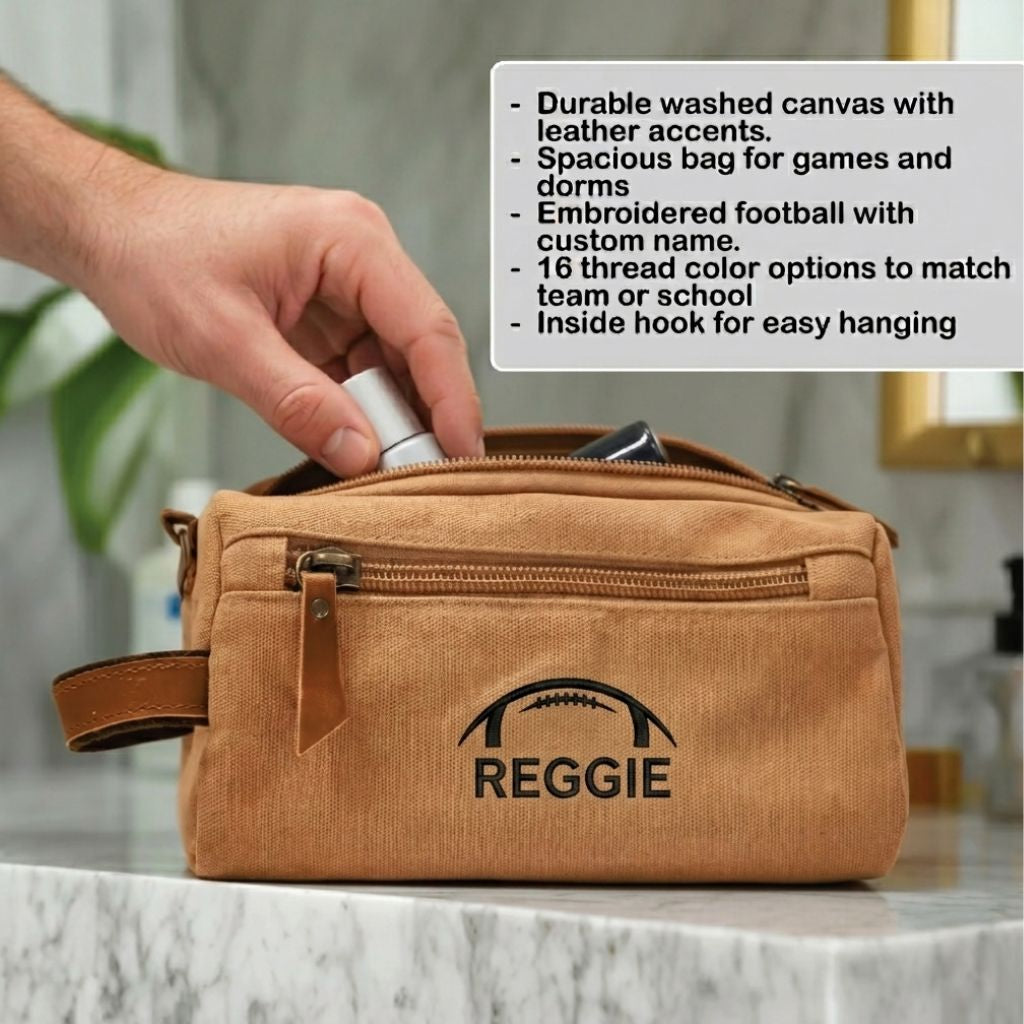 Personalized football toiletry bag in washed canvas with a leather handle and an embroidered football with custom initials, built for road games and college