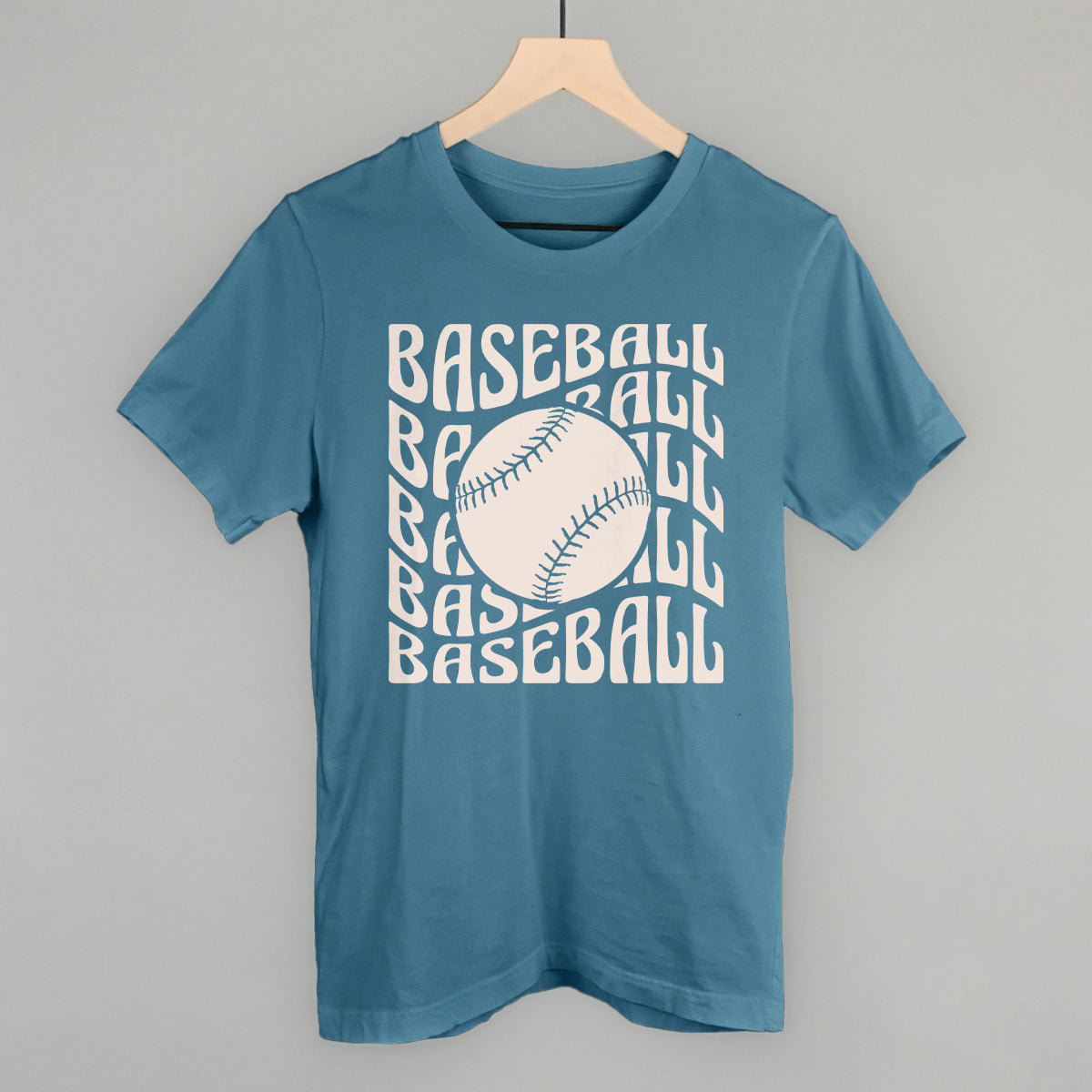 Steel blue Bella+Canvas tee with the Baseball Groovy Wave design in stacked retro lettering and a baseball center, printed in cream ink