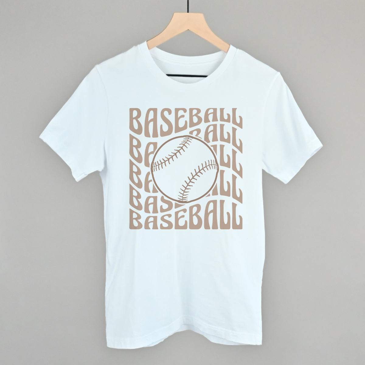 White Bella+Canvas tee with the Baseball Groovy Wave design in stacked retro lettering and a baseball center, printed in cream ink