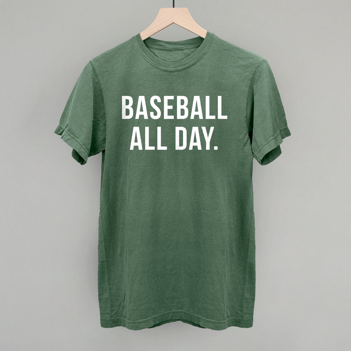 Light green Comfort Colors vintage tee with the 'Baseball All Day.' design in bold white sans-serif lettering