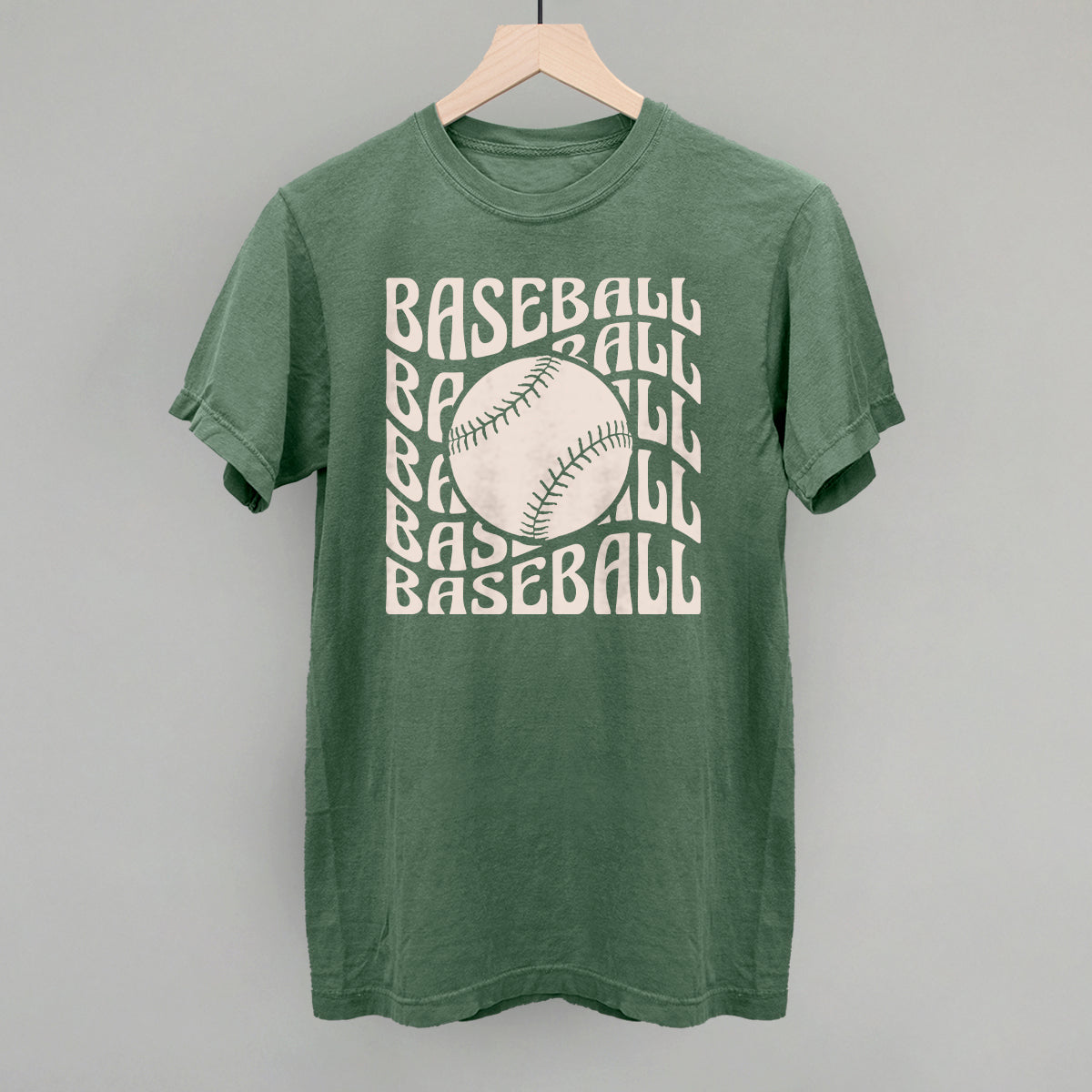 Light green Comfort Colors vintage tee with the Baseball Groovy Wave design in stacked retro lettering and a baseball center, printed in cream ink