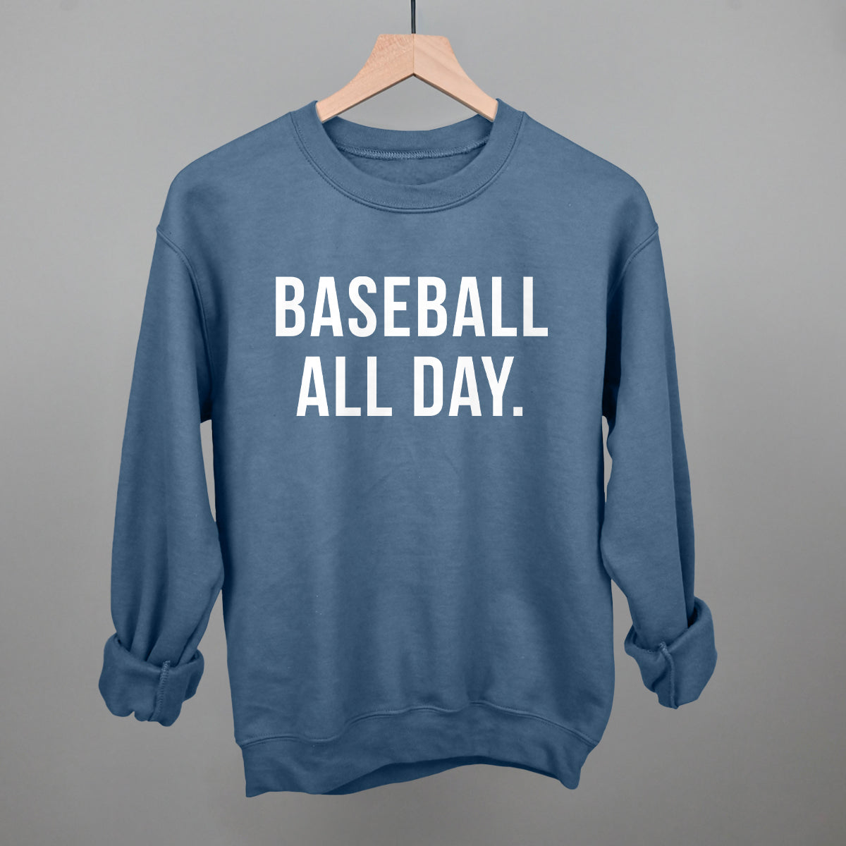 Indigo blue Gildan crewneck sweatshirt with the 'Baseball All Day.' design in bold white sans-serif lettering