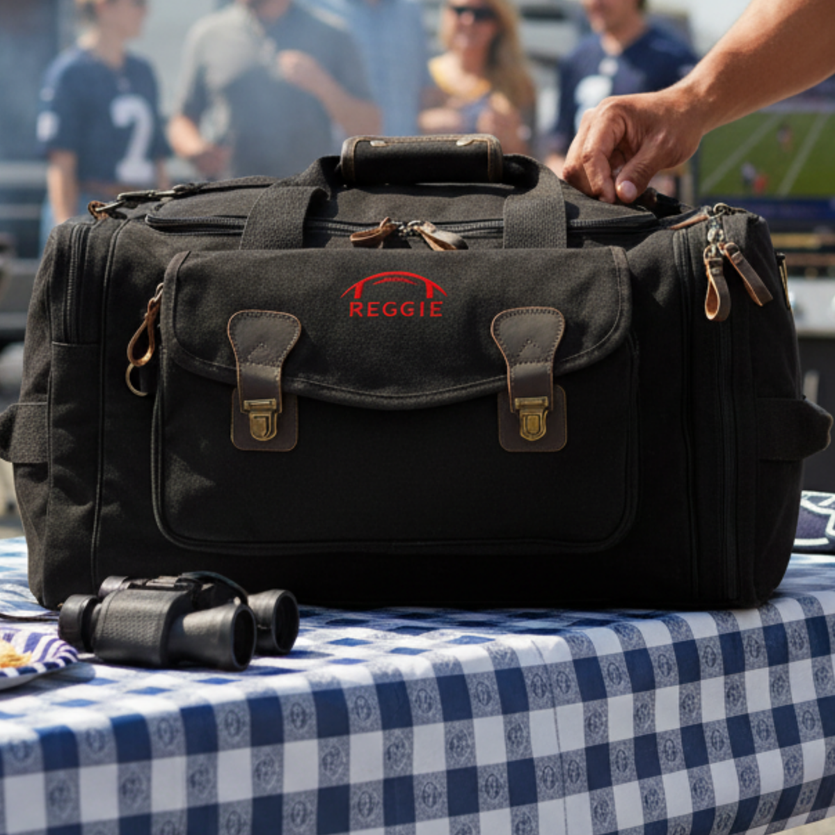 Personalized senior football duffle bag in heavyweight canvas with leather accents and an embroidered football with his name or jersey number stitched underneath