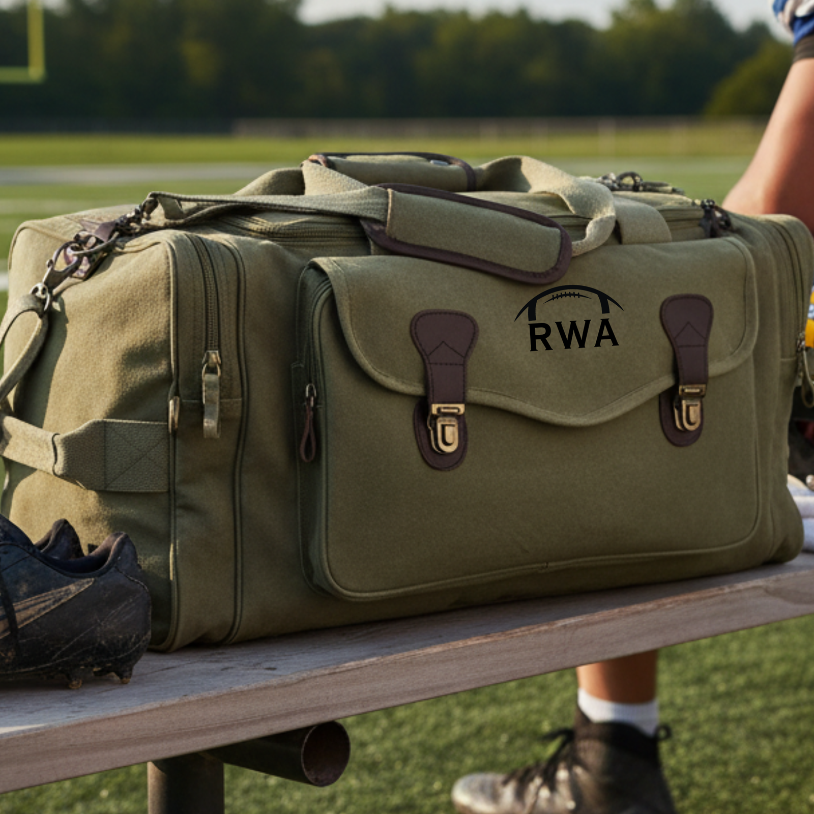Personalized football duffle bag in heavyweight canvas with leather accents and an embroidered football with his name stitched underneath, built for game day gear