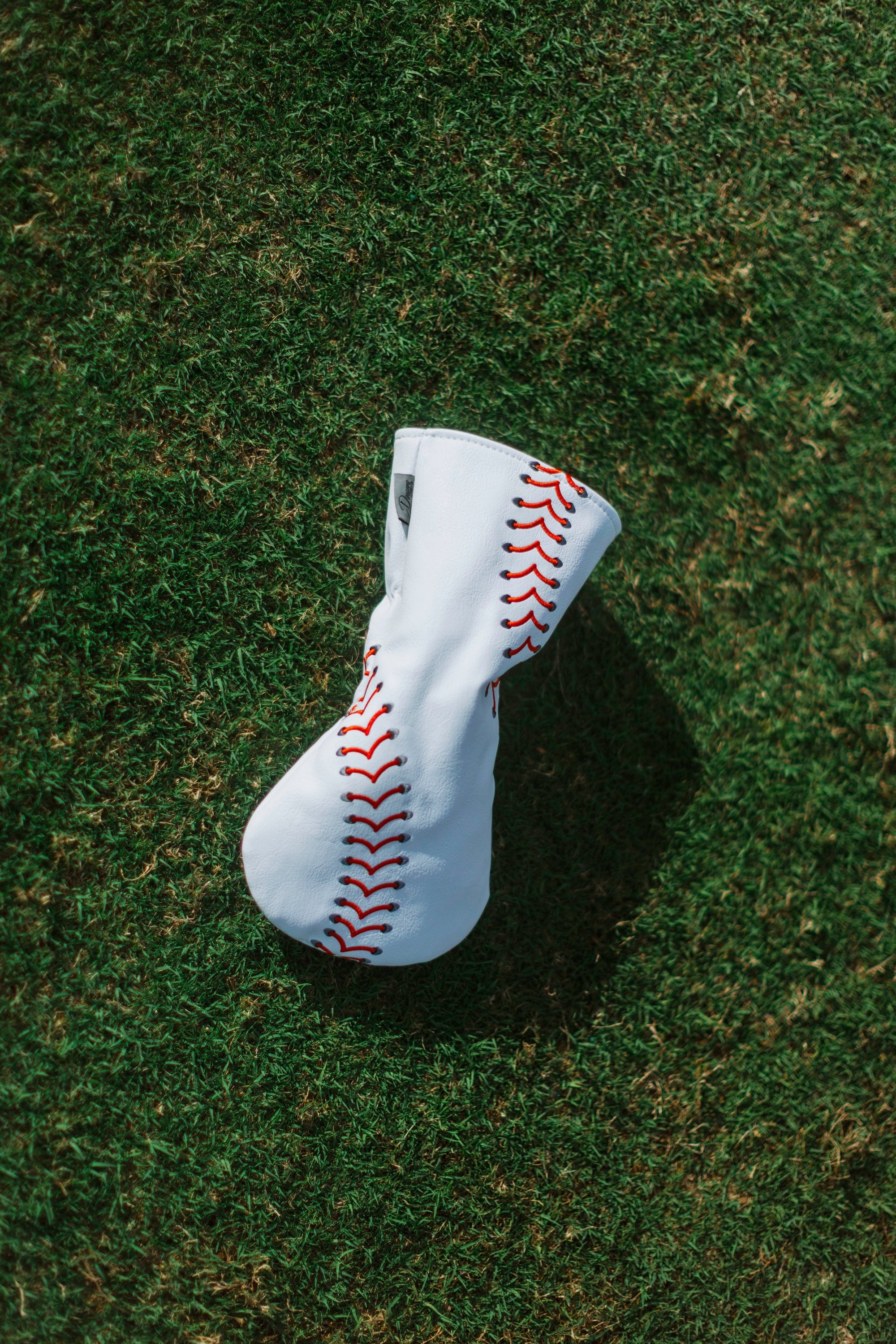 Baseball seam golf headcover with red stitching, PU leather, for driver, wood, or fairway clubs.