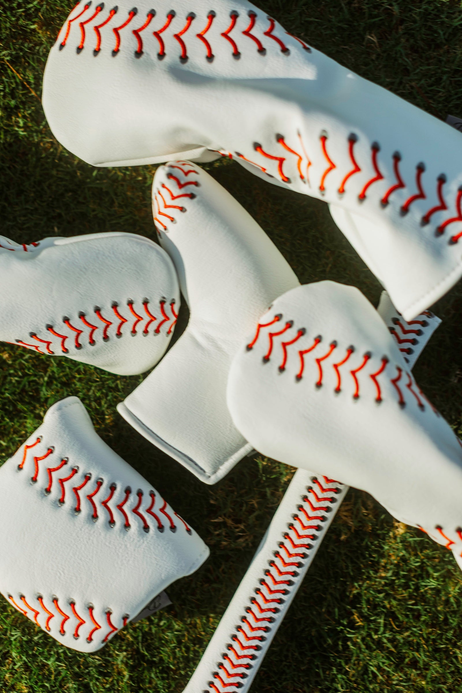 Baseball seam golf headcover with red stitching, PU leather, for driver, wood, or fairway clubs.