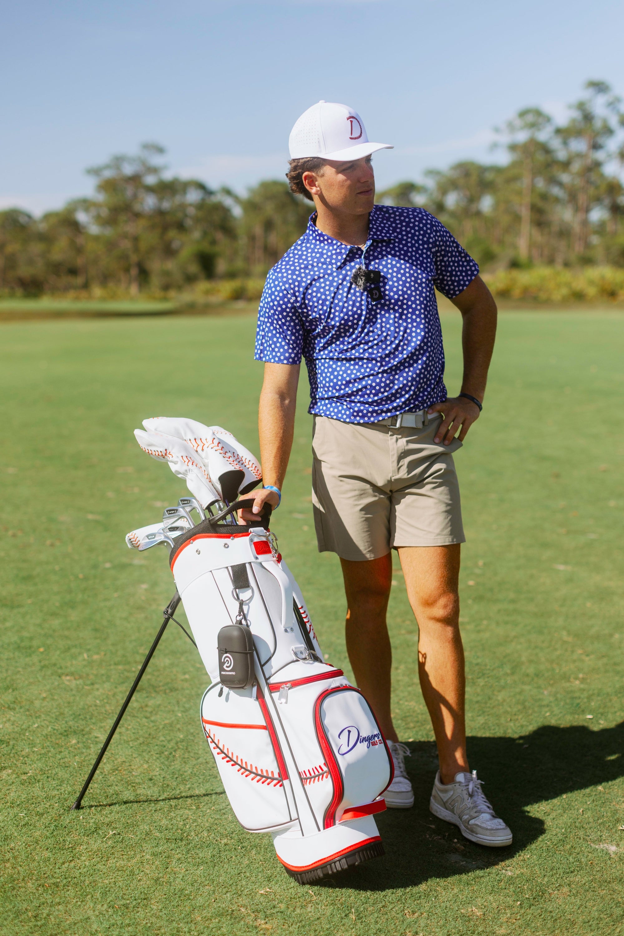 Baseball-inspired PU leather golf bag with red stitching, six pockets, and stand legs.