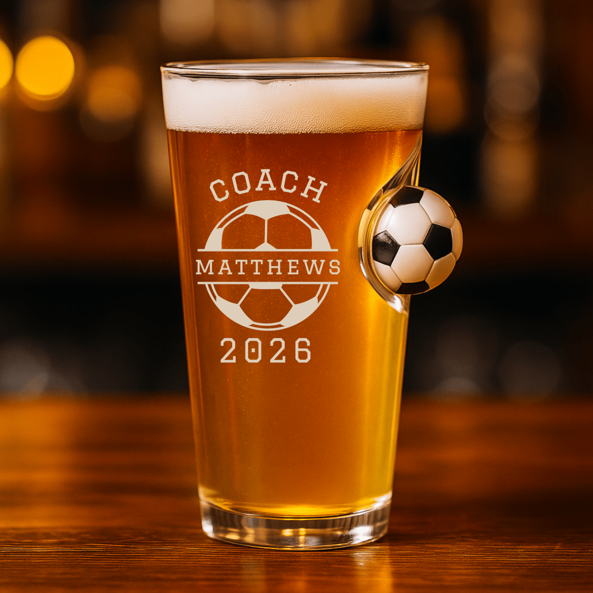 Personalized soccer coach trophy glass, a hefty engraved beer glass with a soccer design and the coach's name, a handcrafted game-day tribute gift