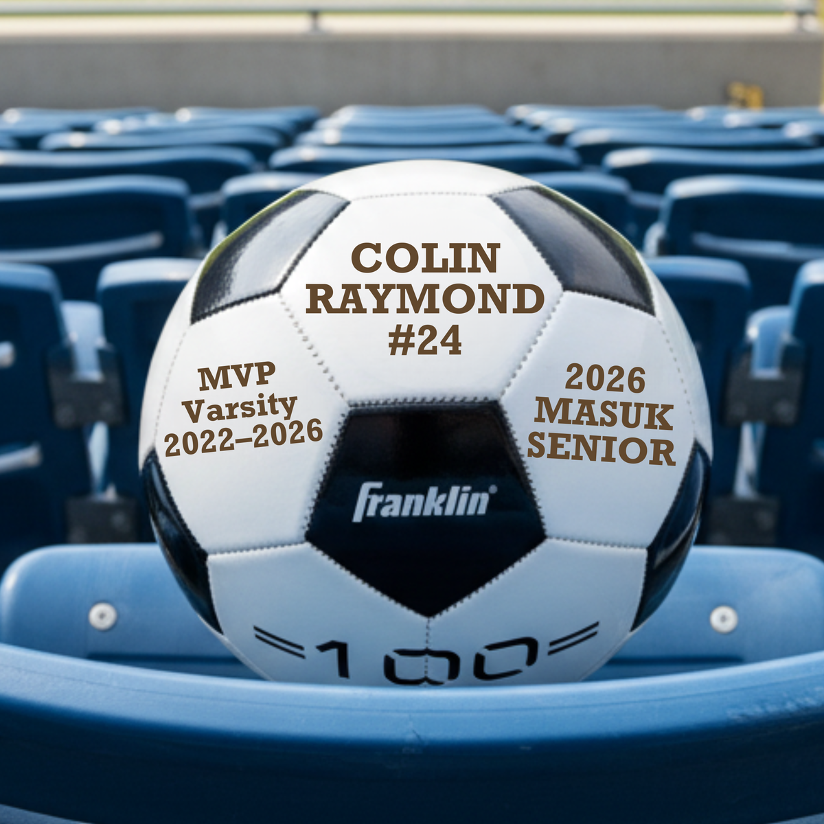 Personalized senior night soccer ball in synthetic leather with warm brown laser engraving across three panels showing the player's name, number, and team