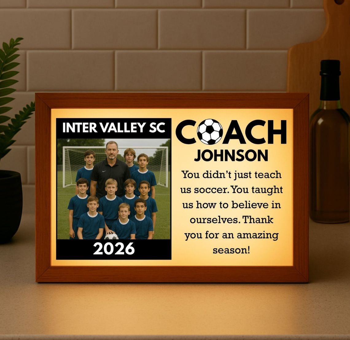 Personalized soccer coach light box in a wood frame with a backlit custom team photo, team name, year, and message, a glowing keepsake for a coach