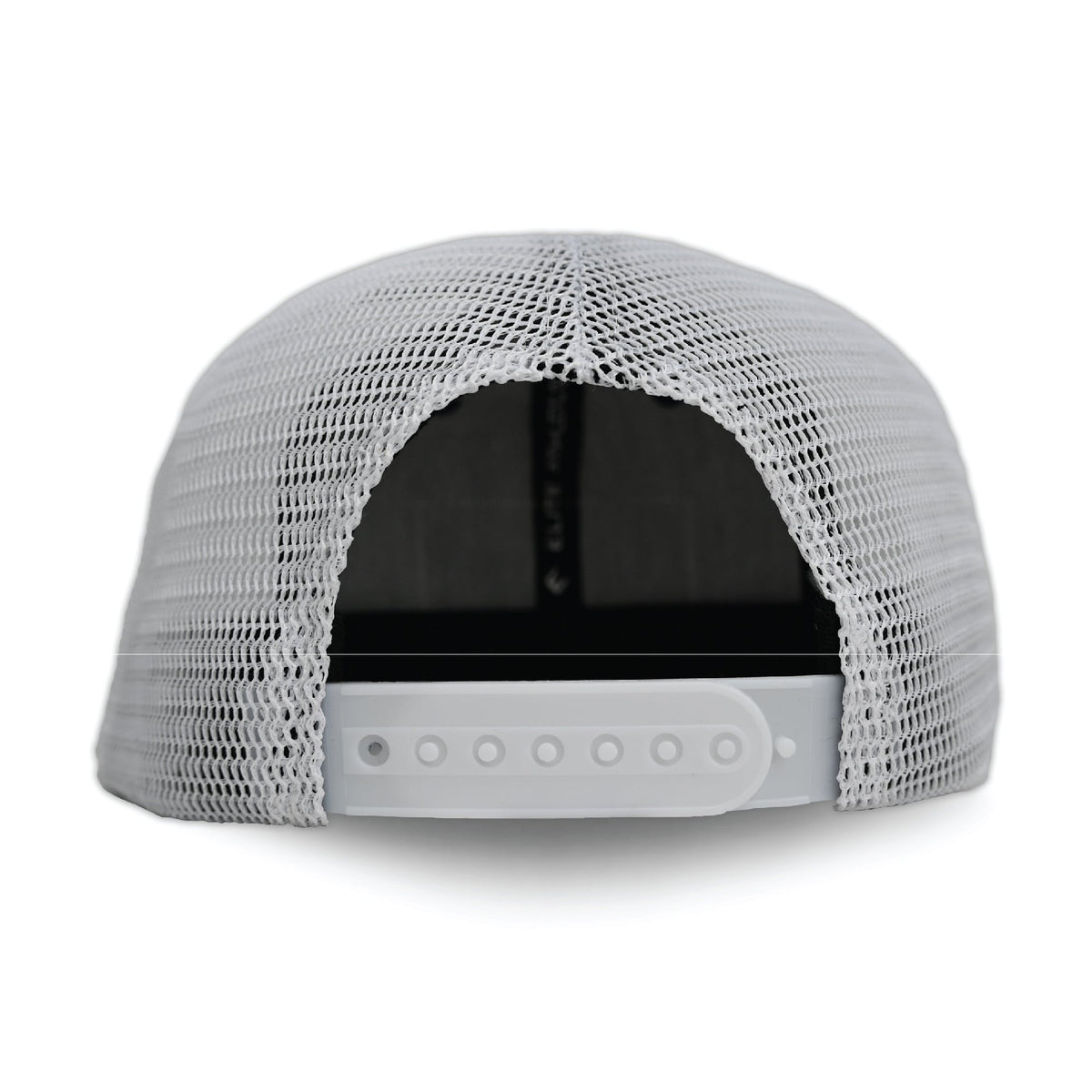 White mesh trucker hat with navy brim and front panel, viewed from back showing adjustable snapback closure with snap buttons