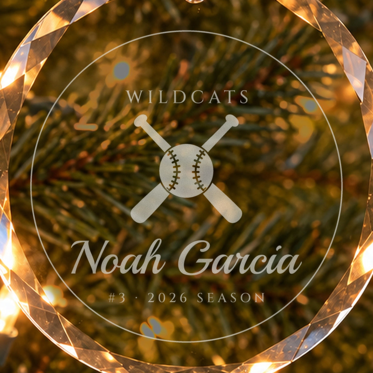 Close-up of the frosted engraving on the baseball ornament: crossed bats and a stitched ball, WILDCATS, Noah Garcia, #3 · 2026 SEASON