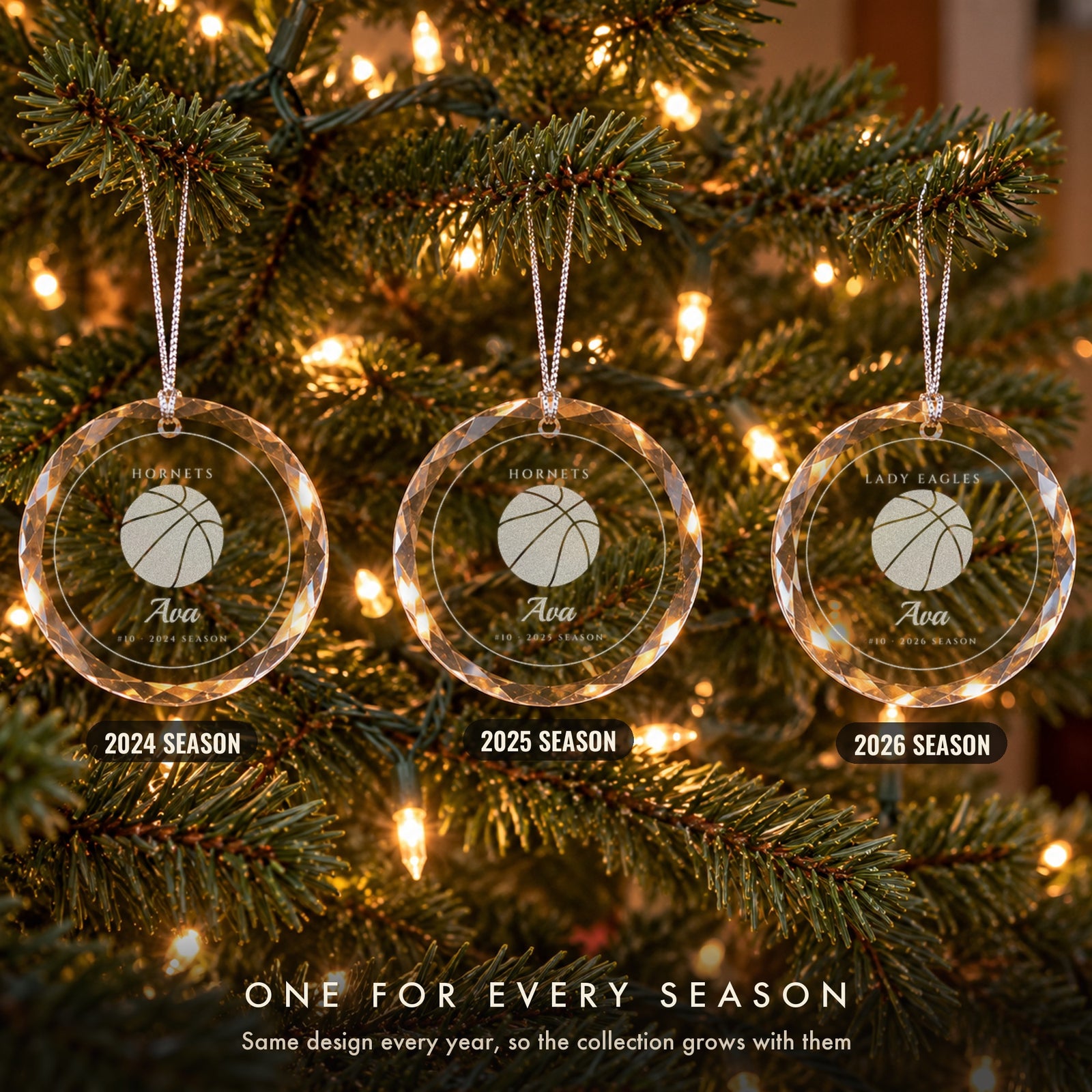 Three personalized basketball Christmas ornaments on a tree, one for each season, engraved Ava #10 for the 2024, 2025 and 2026 seasons