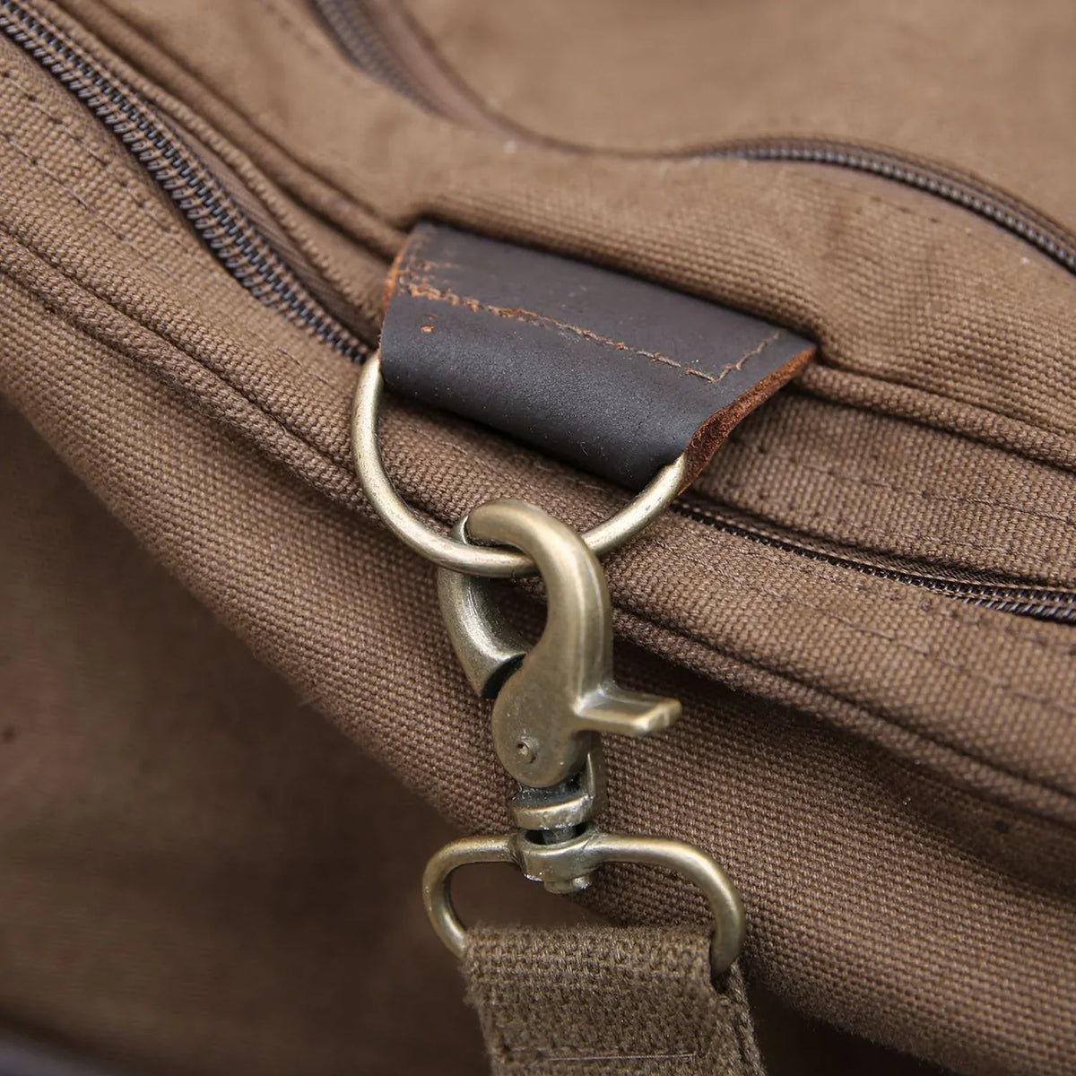 Personalized football duffle bag in heavyweight canvas with leather accents and an embroidered football with his name stitched underneath, built for game day gear