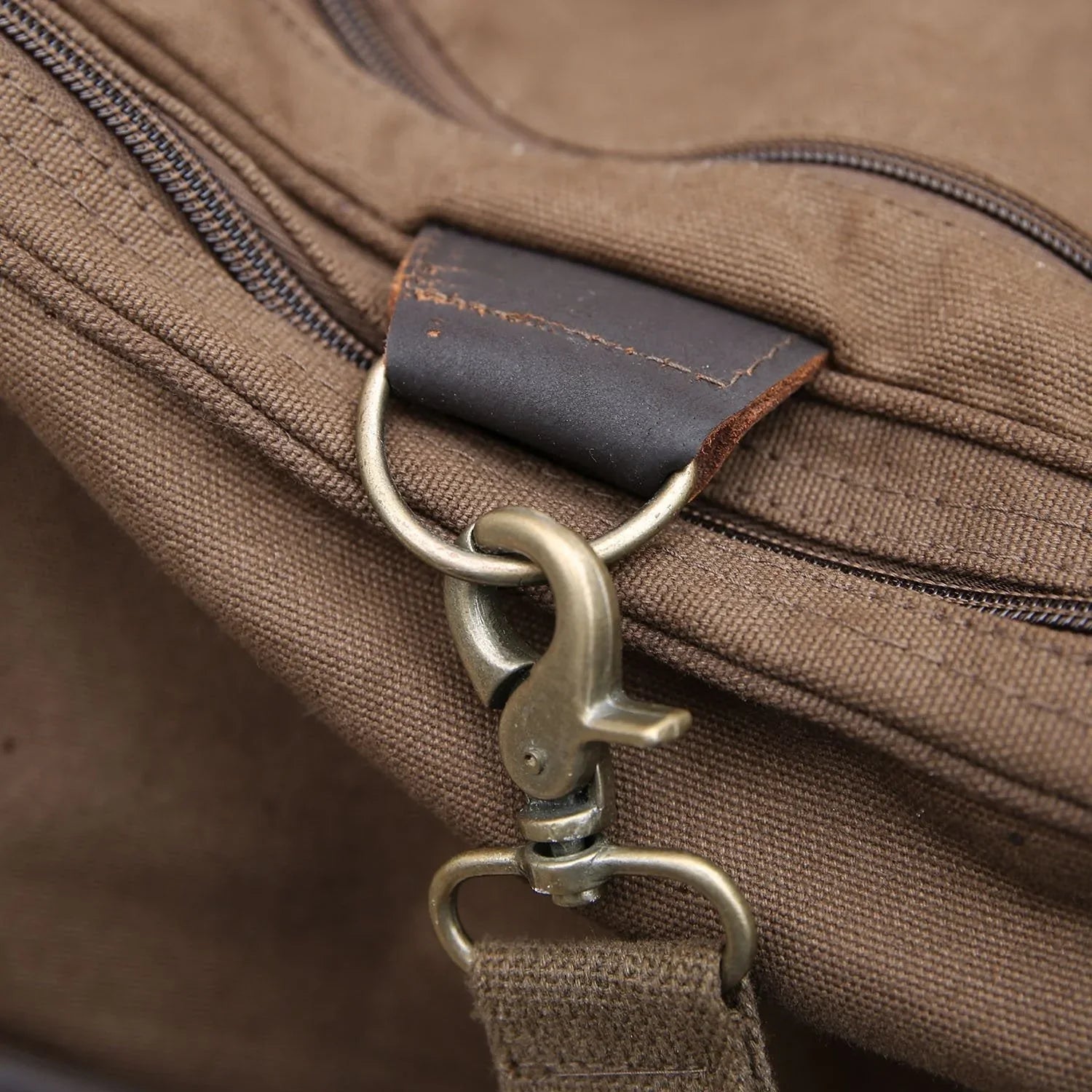 Personalized football duffle bag in heavyweight canvas with leather accents and an embroidered football with his name stitched underneath, built for game day gear