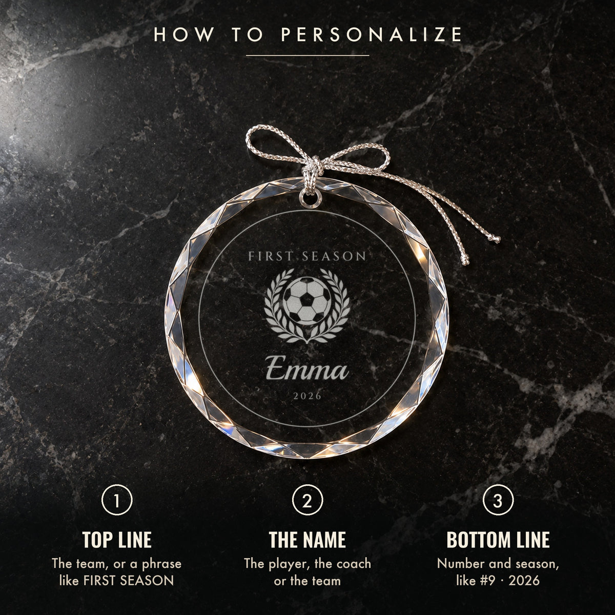 How to personalize the soccer ornament: 1 top line, 2 the name, 3 number and season, shown on black marble engraved FIRST SEASON, Emma