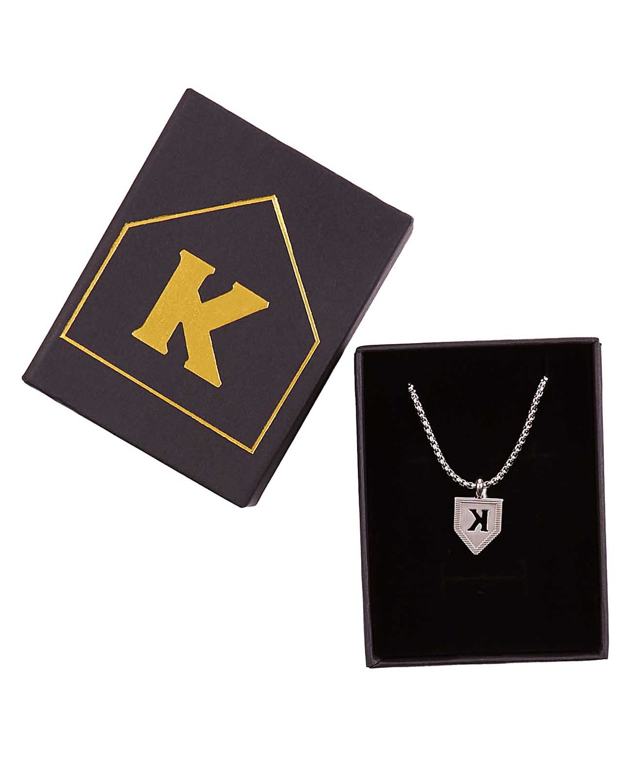 Silver K pendant necklace with cable chain displayed in open black gift box with gold-accented logo lid