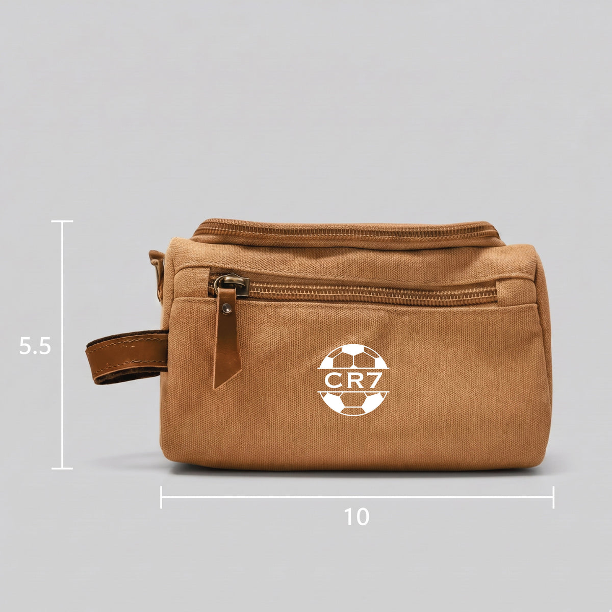 Personalized soccer toiletry bag in washed canvas with a leather handle and an embroidered soccer ball with custom initials, built for road games and college