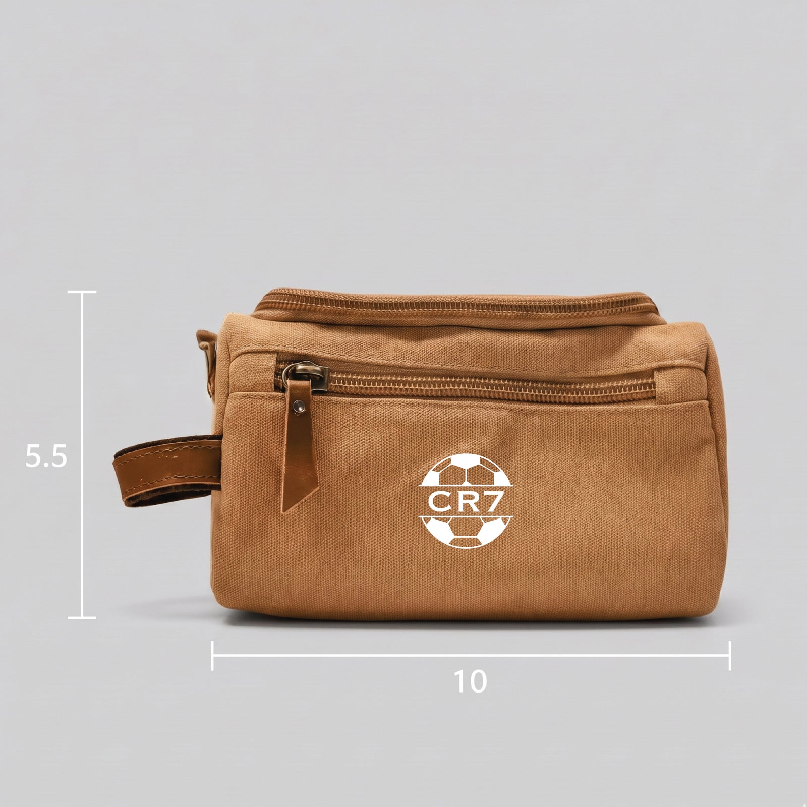 Personalized soccer toiletry bag in washed canvas with a leather handle and an embroidered soccer ball with custom initials, built for road games and college