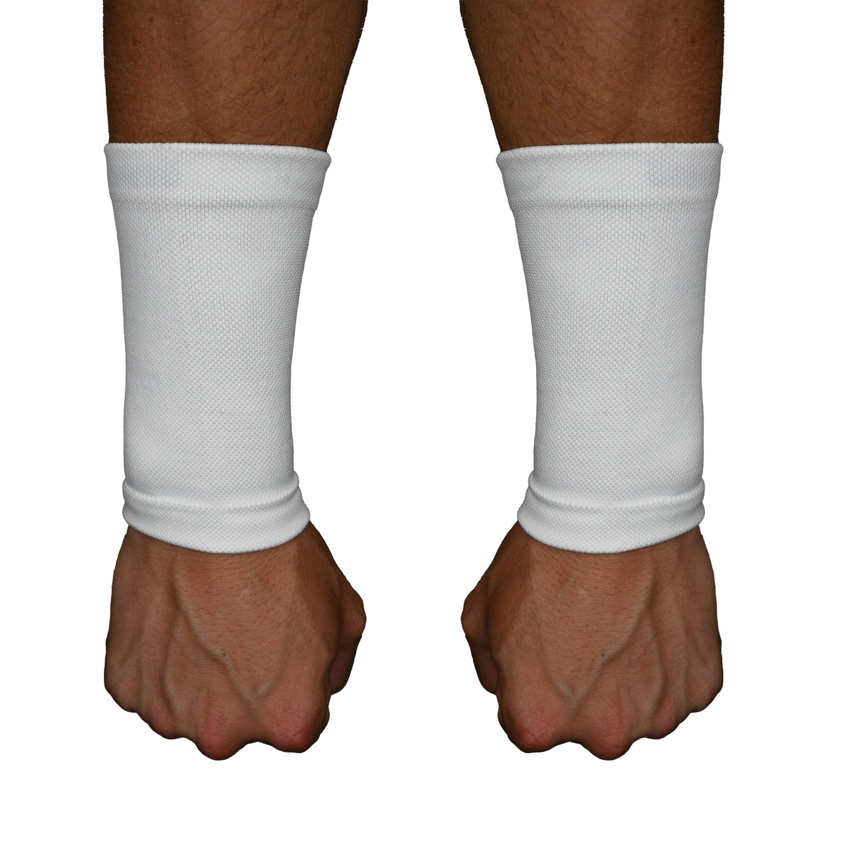 Pair of white wrist support sleeves worn on the wrists and lower forearms, showing the mesh compression fabric and snug fit around the wrist joint.