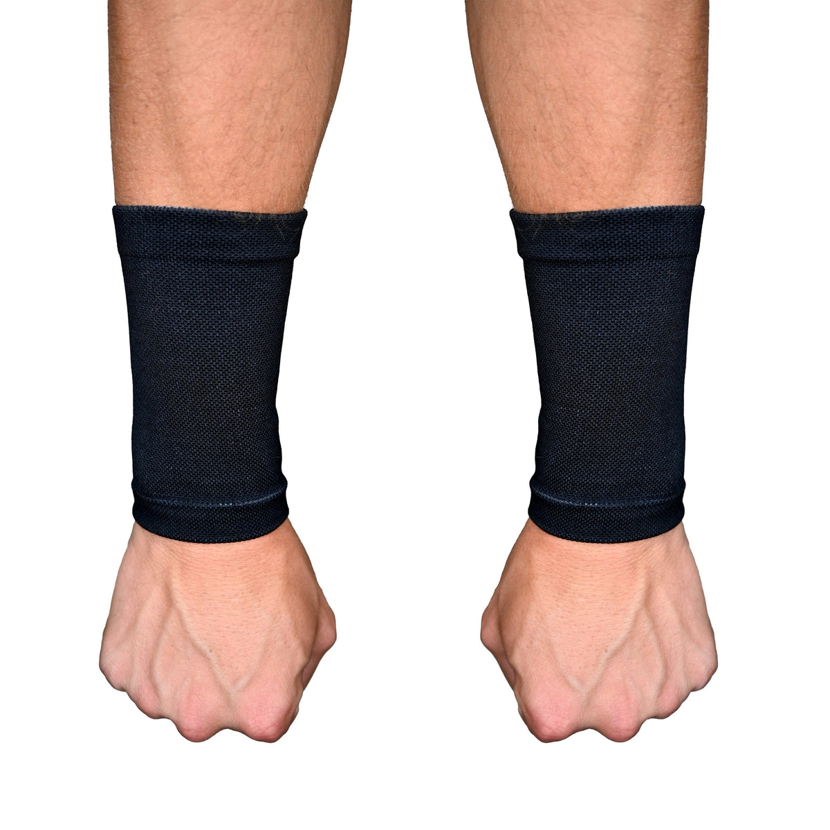 Pair of black wrist support sleeves worn on both wrists, showing seamless knit construction and compression fit around the wrist and lower forearm area.