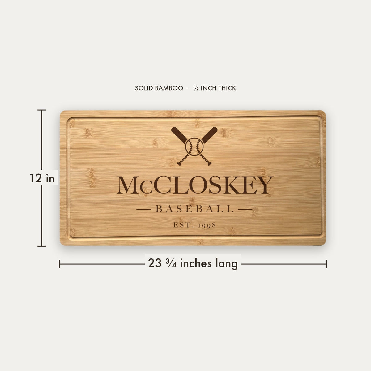 Size guide for the personalized baseball cutting board, 23 and three quarter inches long by 12 inches wide in half inch thick solid bamboo.
