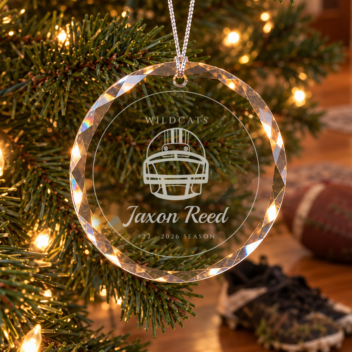Personalized football ornament in faceted glass on a Christmas tree, engraved with a football helmet, WILDCATS, Jaxon Reed, #22 · 2026 SEASON