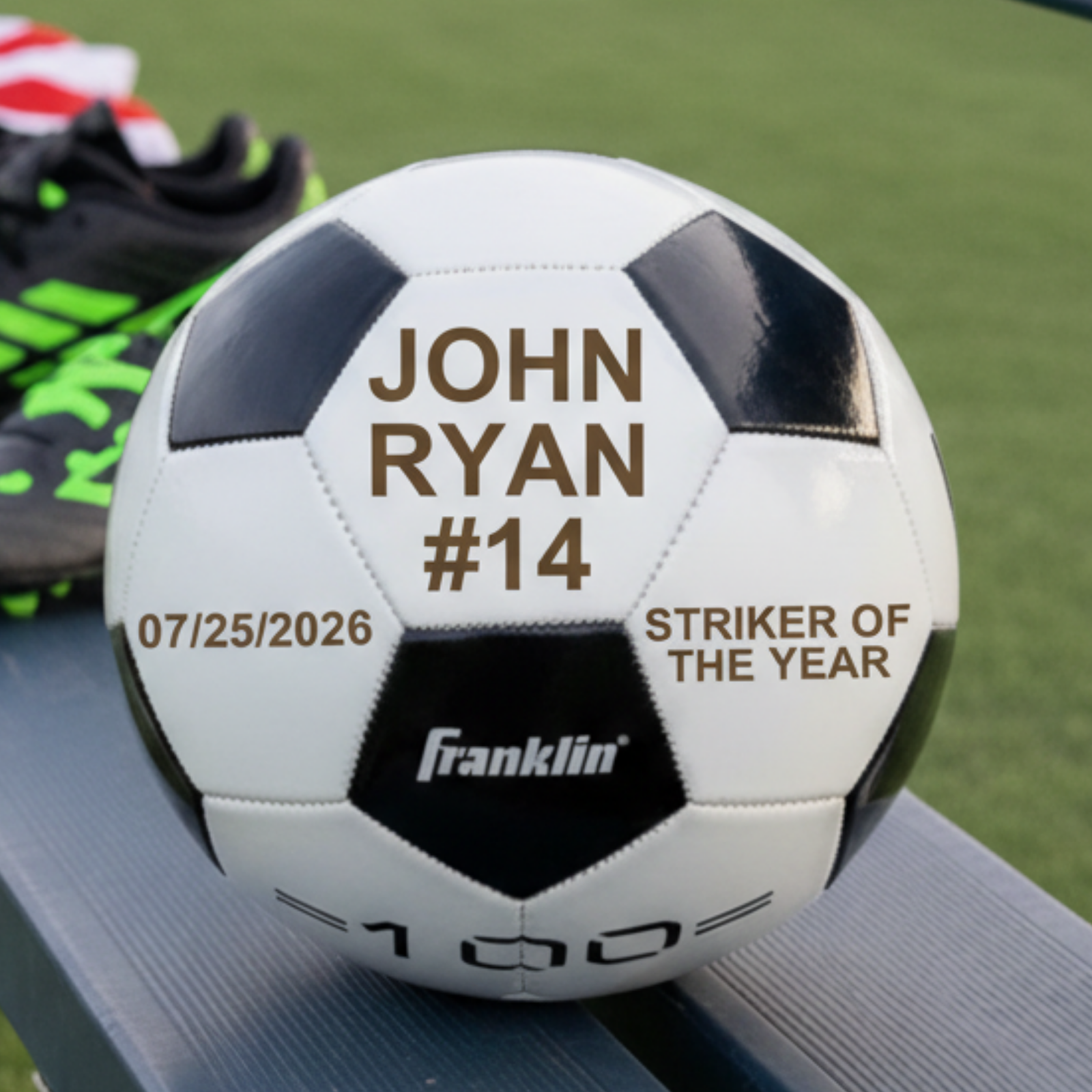 Personalized soccer ball with name and number John Ryan #14, a date and Striker of the Year engraved across three white panels
