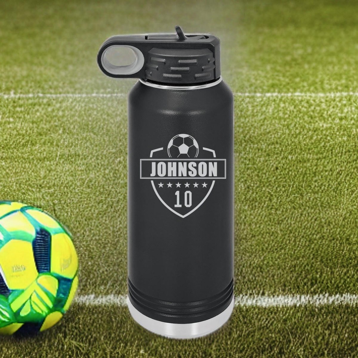 Personalized soccer water bottle in insulated stainless steel with a laser-etched soccer ball design and a player's name and number engraved on the side